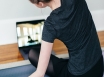 woman stretching online physiotherapy